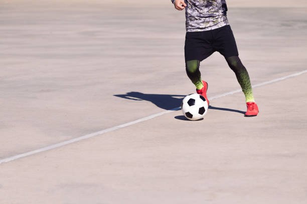 istock unrecognizable sportsman playing with the ball 1297688868