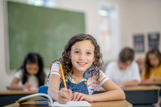 istock School girl in classroom 1297688958