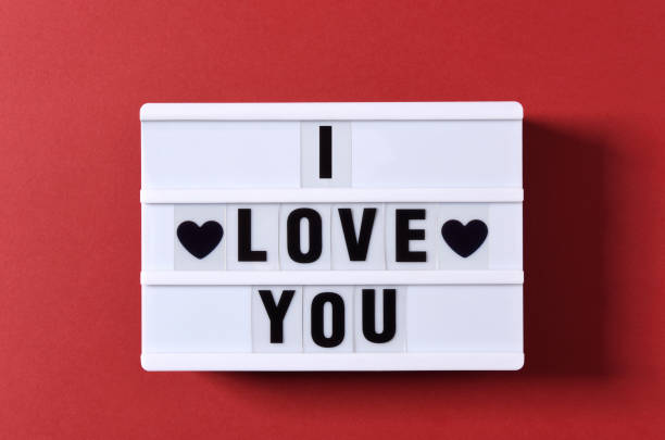 istock Love Text And Red Heart Shape on White Light Box 1297696145
