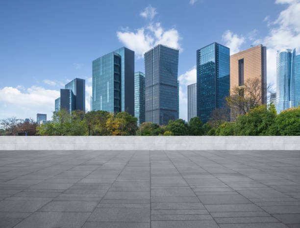 istock empty pavement and modern buildings in city 1297696197