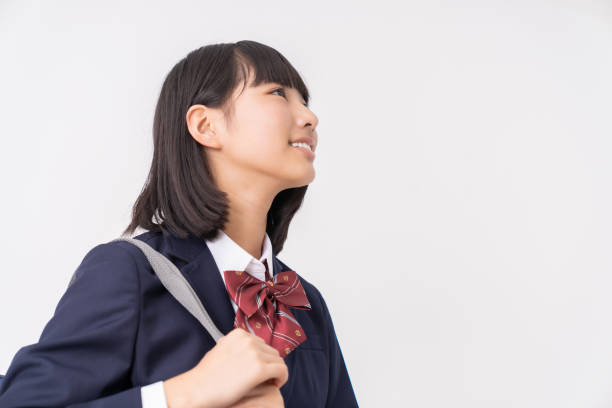 fille qui étudient, uniforme scolaire, - uniforme scolaire japonais photos photos et images de collection