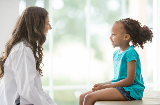 istock Doctor and young patient 1297699777