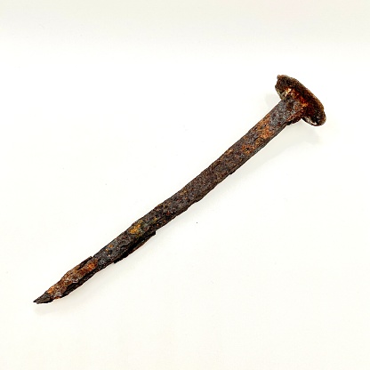 Antique iron nail covered with rust