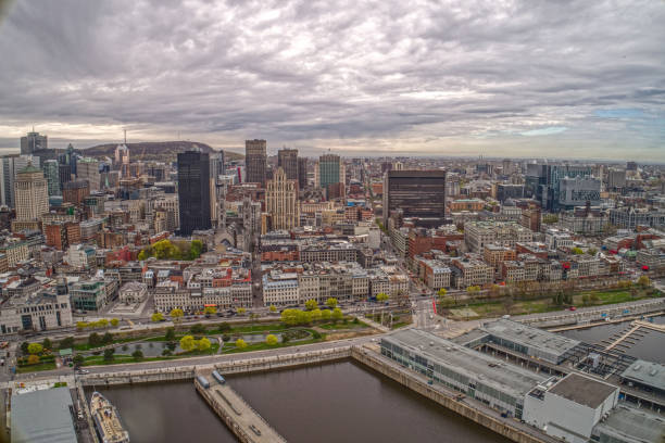 aerial view of the montreal skyline and harbor on a cloudy day in may - lawrence quebec canada north america imagens e fotografias de stock