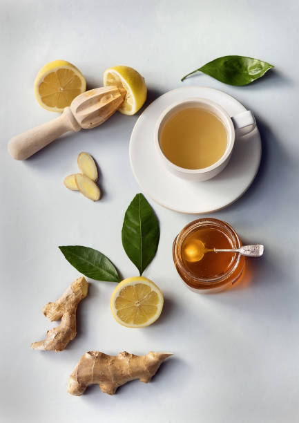 istock Ginger, honey and lemon herbal tea. Flat lay, top view. 1297708914