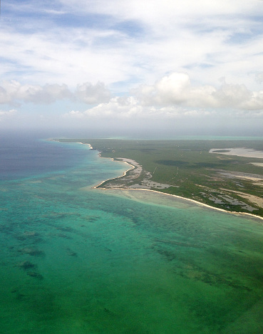Looking at the Caribbean Sea and the Island of Providenciales in the Turks and Caicos Islands from above.
