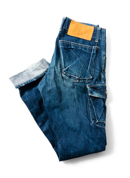 istock Blue jeans on a white background. View from above 1297710256