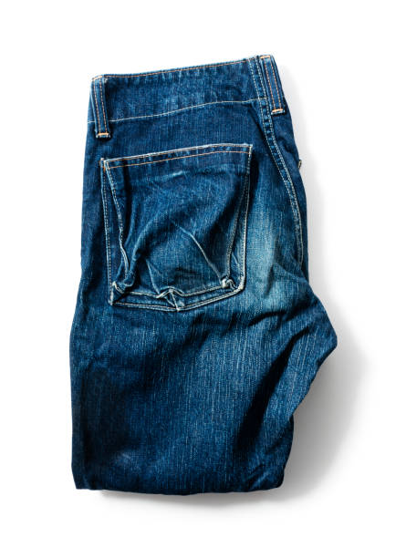 istock Blue jeans on a white background. View from above 1297711019