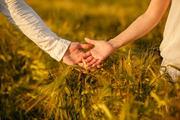 istock Couple about to hold hands while walking in nature 1297718324