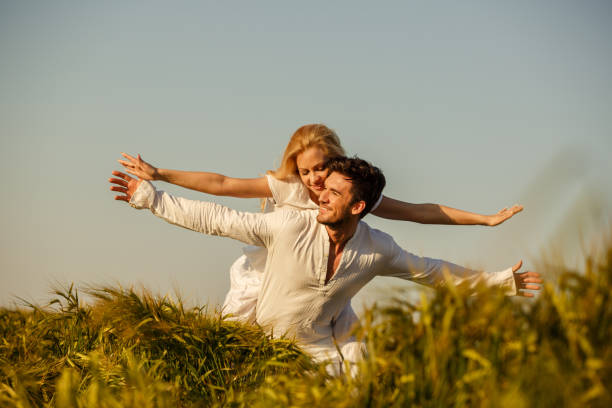istock Playful couple in a piggyback 1297718871