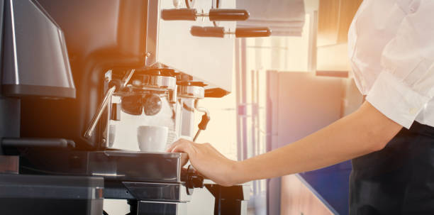 istock Coffee machine pours fresh espresso into the cups 1297721689