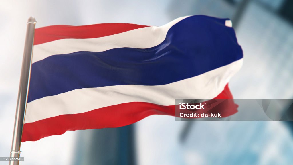 National Flag of Thailand Against Defocused City Buildings Thai Flag Stock Photo
