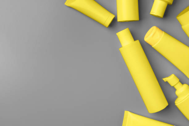 istock Yellow cosmetic container on gray background top view 1297722613