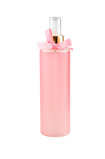 Pink plastic spray bottle of body mist with pink ribbon, no label