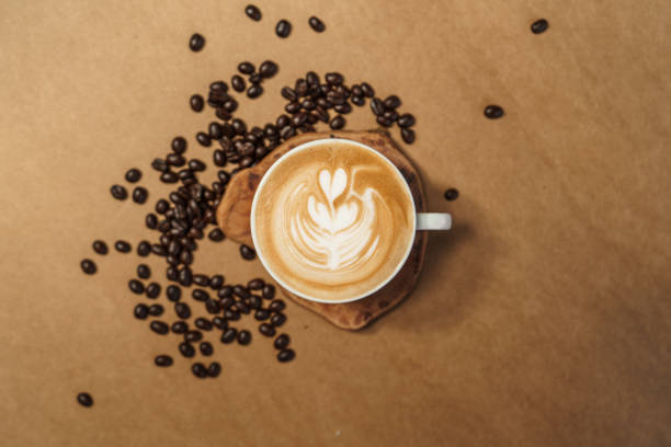 istock Hot Drink,Coffee latte in a cup Brown background 1297727397