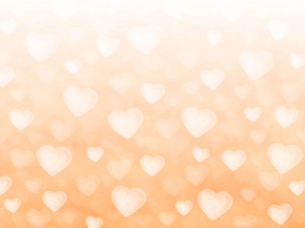 istock Illustration of a group of white hearts on an orange background. 1297728954