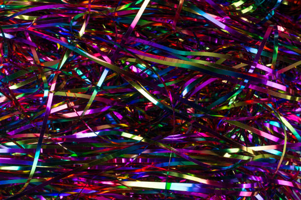 istock Festive background. Lots of multicolored tinsel close-up. 1297729485