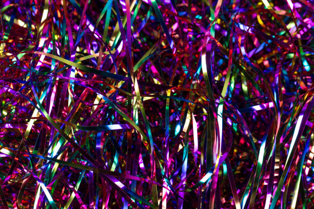 istock Festive background. Lots of multicolored tinsel close-up. 1297729549