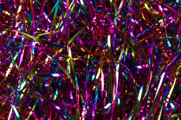 istock Festive background. Lots of multicolored tinsel close-up. 1297729571