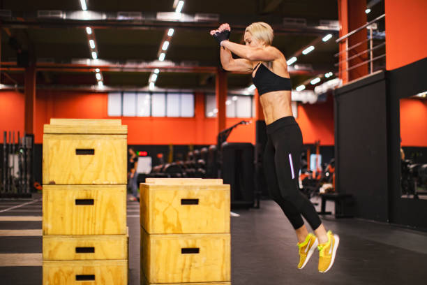 istock Woman athlete in Gym 1297730259