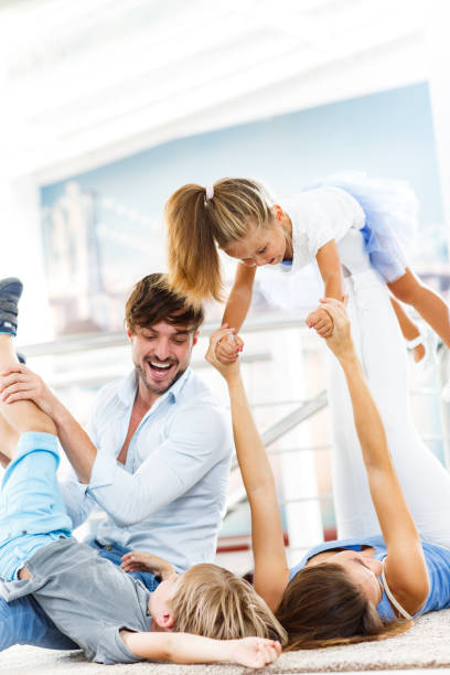 istock Young playful family having fun at home. 1297730873