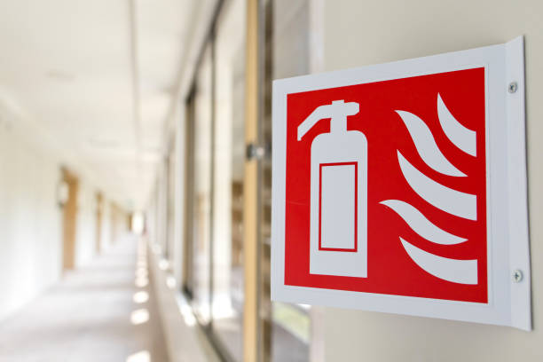 Fire extinguisher station sign on a wall. Indicating that there is a fire extinguisher, which can be found quickly if necessary.