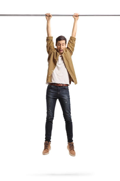 istock Scared man hanging and holding onto a bar 1297734104