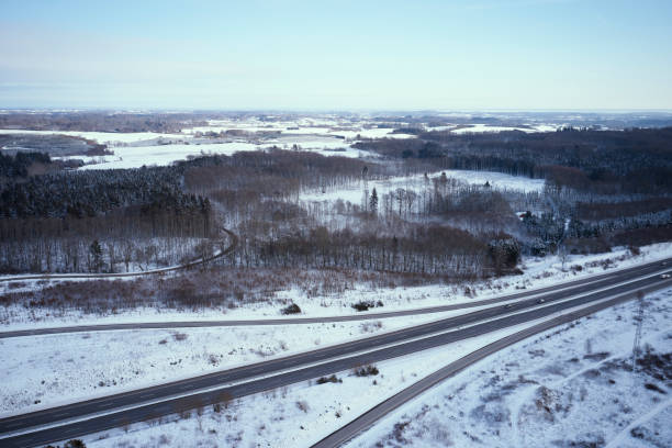 istock Winter landscape with snow and road 1297735024