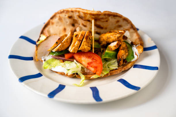 istock Chicken shawarma with vegetable salad in pita bread. 1297735397