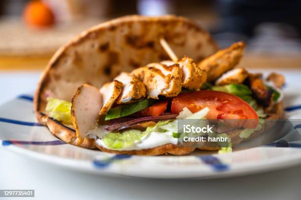 Chicken Shawarma In Pita Bread With Vegetable Salad On Plate Stock Photo - Download Image Now