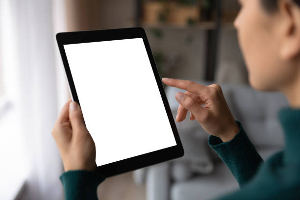 istock Close up woman use tablet texting online 1297735520