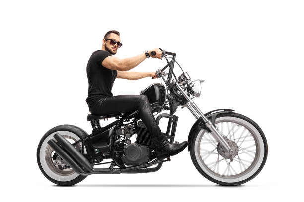 istock Man with sunglasses riding a chopper motorbike 1297736607