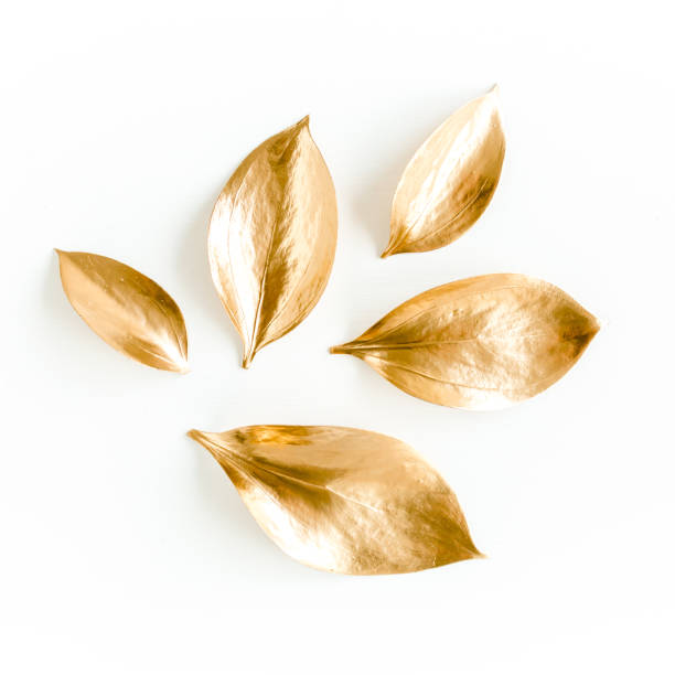 istock Pattern, texture with gold leaves isolated on white background. flat lay, top view 1297737648