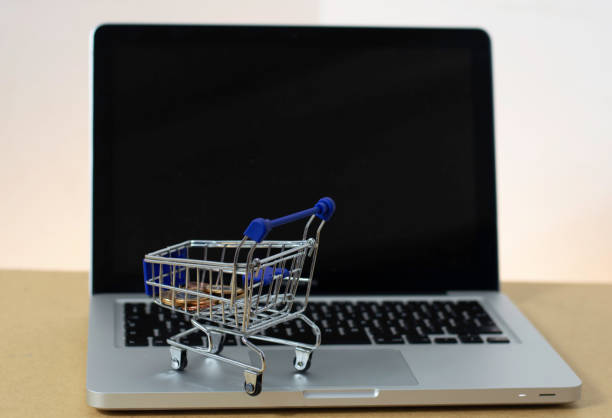 istock Laptop computer mini trolley online shopping 1297737999