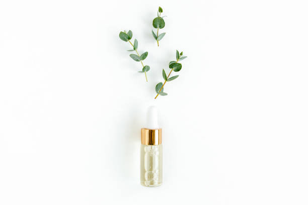 istock Eucalyptus essential oil, eucalyptus leaves on white background. Natural, Organic cosmetics products. Medicinal, Natural Serums. Flat lay, top view 1297739063