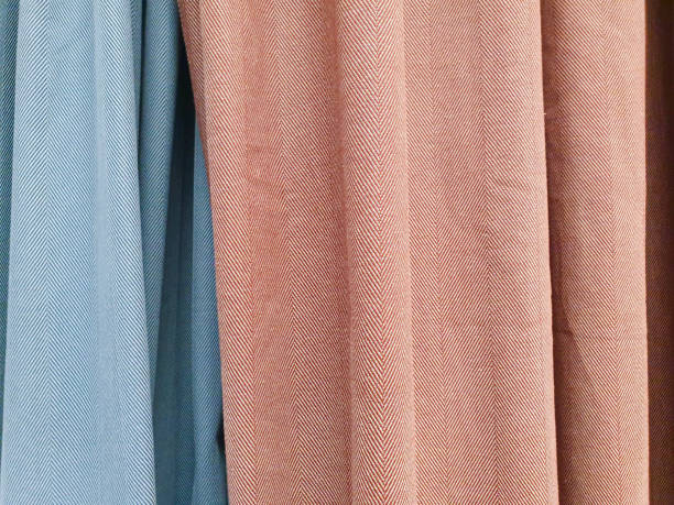 istock Blue and red curtains, blackout curtains. Close-up. Herringbone cotton pattern, cotton fabric background texture. Interior material background. 1297739975