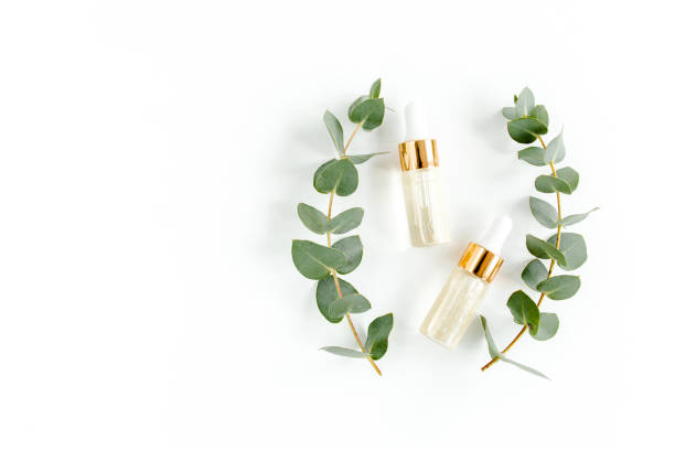 istock Eucalyptus essential oil, eucalyptus leaves on white background. Natural, Organic cosmetics products. Medicinal, Natural Serums. Flat lay, top view 1297740021