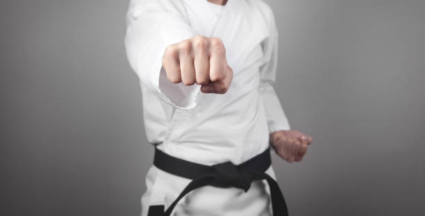 istock Caucasian male punch. Doing karate. Martial arts 1297740241
