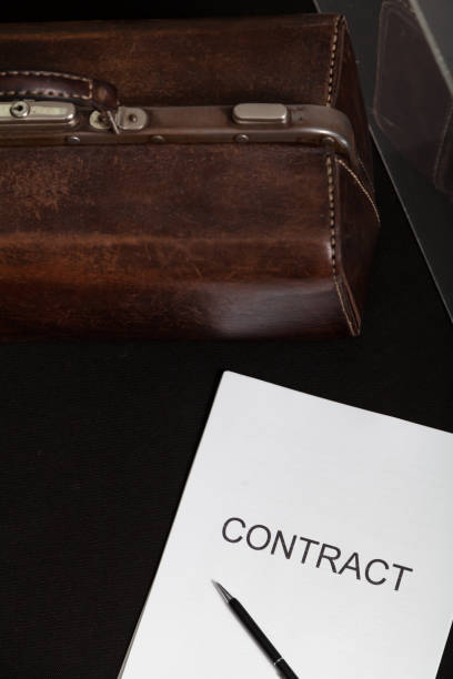 istock Contract and leather carpetbag close-up 1297742337