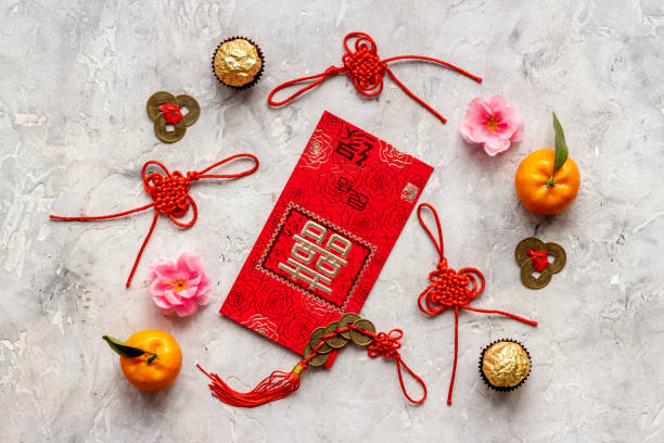 istock Chinese New Year decorations top view. Red lanterns and postcard with chatacter means double happiness 1297744503