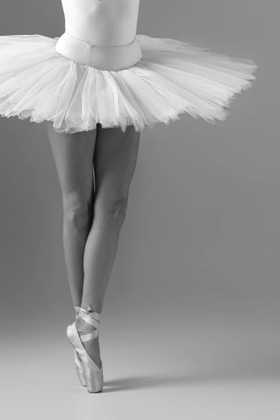 istock Ballerina in tutu and pointe shoes 1297744639