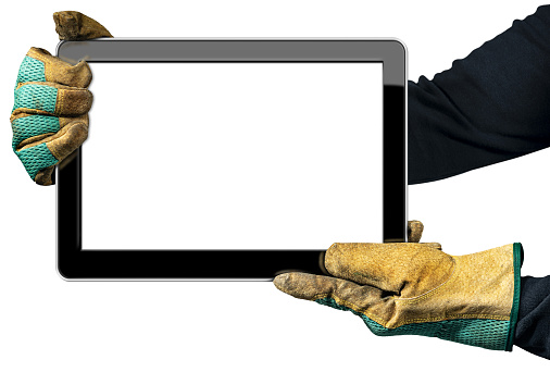 Two hands with work dirty gloves showing an empty digital tablet, isolated on white background with copy space.