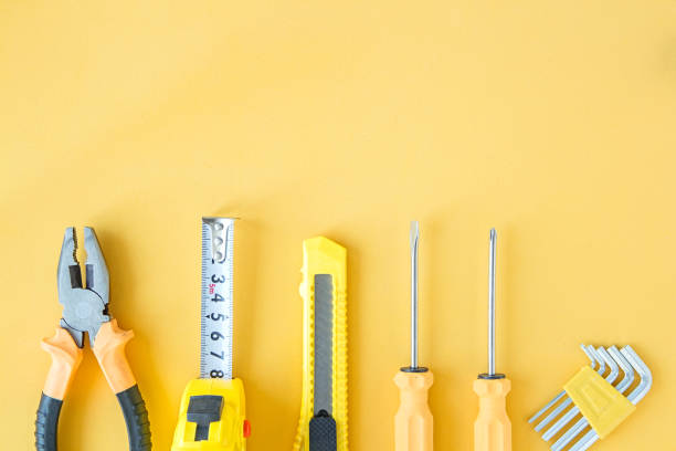 istock Tools for repair and construction on yellow background. Copy space, flat lay. Construction background 1297746412