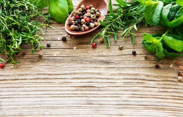 istock Fresh herbs and spices on wooden background top view 1297747576