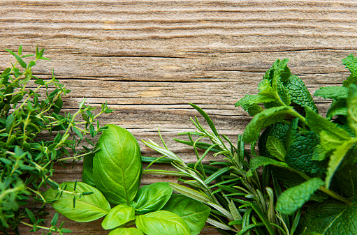 Fresh herbs  on wooden background top view