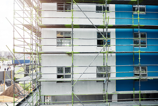 Shot of scaffolding and a building at a construction site