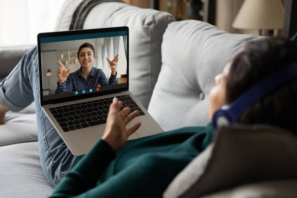 istock Woman look at laptop screen talking on video call 1297748171