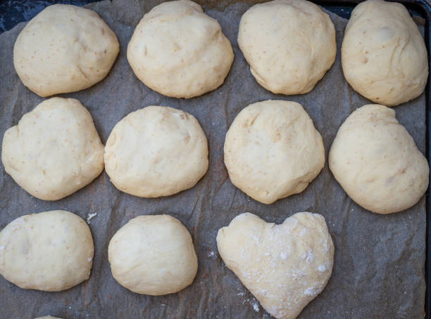 istock Bread dough  on floured board waiting to rise. ,making bread rolls at home. 1297751308