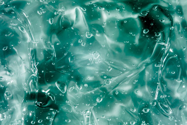istock Liquid cream gel, green blue cosmetic texture with bubbles 1297752688