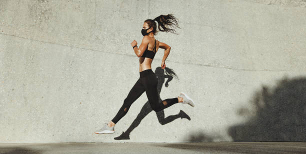 istock Fit woman sprinting outdoors 1297752917